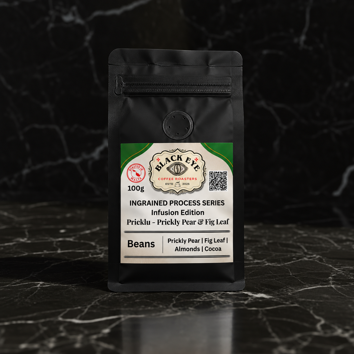 Pricklu 100g whole bean infused coffee in a matte black bag on dark marble — Black Eye Coffee Roasters